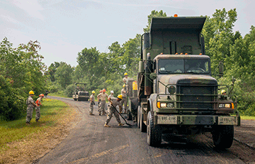 Members of the 291st and 292nd Engineer Detachments conduct paving operations at Fuse and Booster Spur roads June 20, 2016.