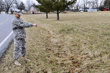 Sgt. First Class Chris Meinhardt, an 18-year veteran of the Ohio Army National Guard, shows where he saw a young boy walking.