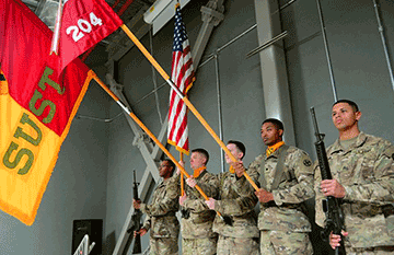 The 1st Cavalry Division Resolute Support Sustainment Brigade Color Guard presents the colors.
