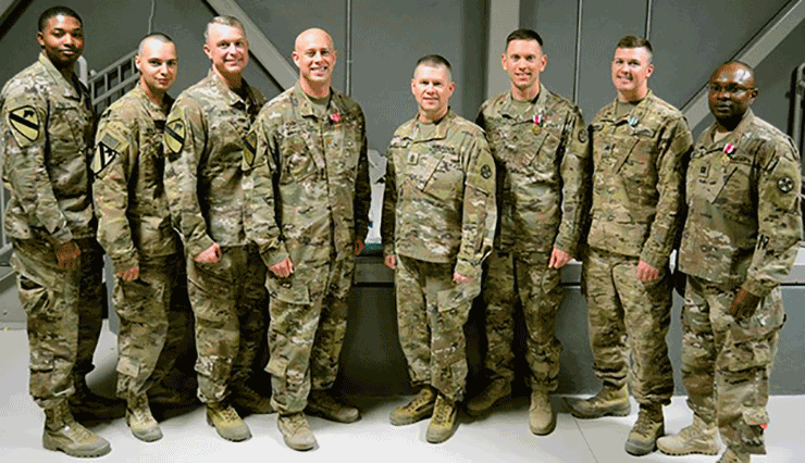 Soldiers assigned to the 204th Engineer Detachment stand for a photo.