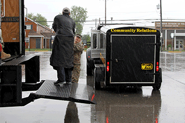 Maj. Matthew Toomey, operations officer for the Ohio National Guard Counterdrug Task Force works alongside DEA and local law enforcement personnel to collect boxes of unwanted prescription drugs.