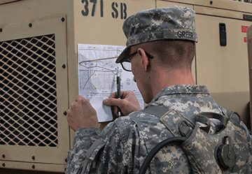 Spc. Michael J. Greer, a wheeled vehicle mechanic with the 637th Chemical Company, conducts land navigation.
