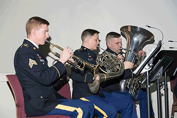 Members of army band playing.
