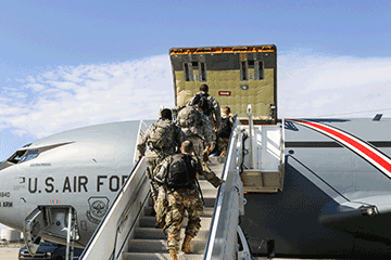 Soldiers of the 1483rd Transportation Company board a KC-135 Stratotanker, operated by the 121st Air Refueling wing