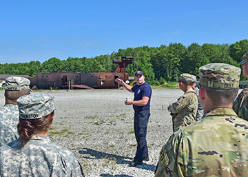 Cody Anderson, a firefighter for the 910th Airlift Wing Fire Department, welcomes Soldiers of the Ohio Army National Guard’s 5694th Engineer Detachment.
