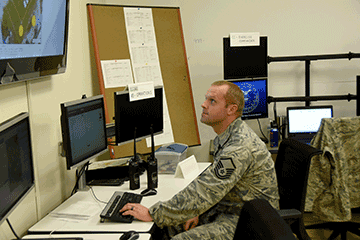 Master Sgt. Brian Lawrence of the 269th Combat Communications Squadron views a monitor.