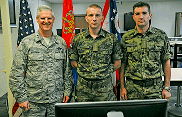 Maj. Gen. Mark E. Bartman (left), Ohio adjutant general, stands with members of the Serbian Armed Forces.