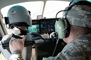Airmen in cockpit.