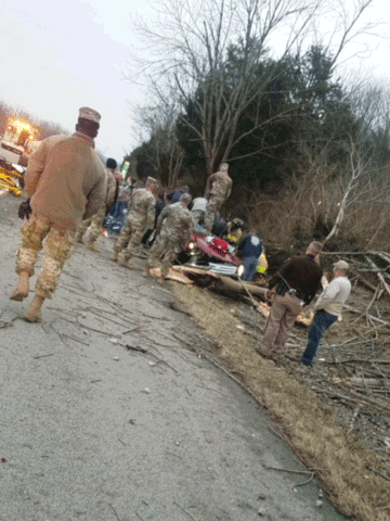 Soldiers with 1st Platoon, Troop B, 2nd Squadron, 107th Cavalry Regiment provide medical care to a critically injured driver along Interstate 74 in March 17, 2018, in southeastern Indiana. The unit was returning from training at Camp Atterbury, Indiana when it came across the crash moments after it happened. 