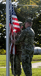 Ohio National Guard Soldiers raise the U.S. flag.