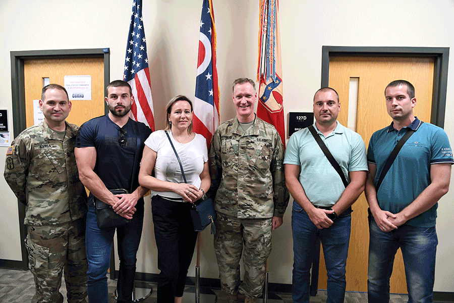 Brig. Gen. Steven E. Stivers and Sgt. Maj. Scott Barga stand for a photo with members of the Serbian Ministry of Interior.