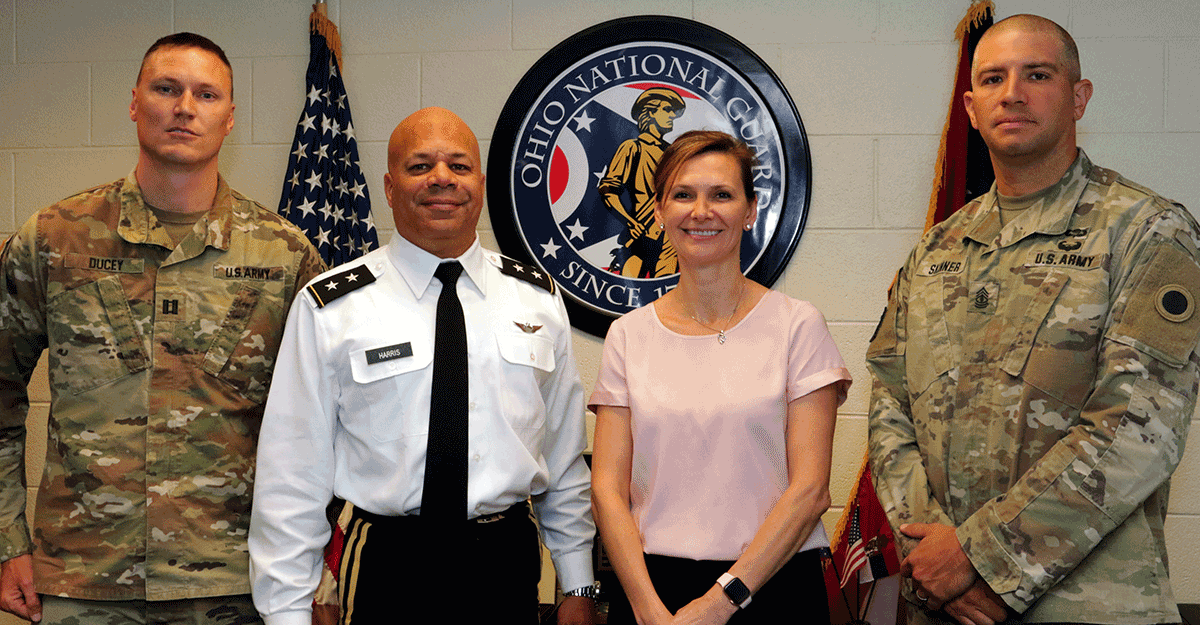 Adjutant General stand with SPP director and coordinators.