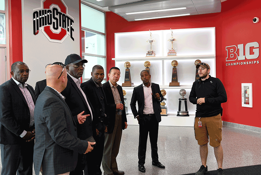 Members from delegation are given a tour inside lobby at OSU Schottenstien center.