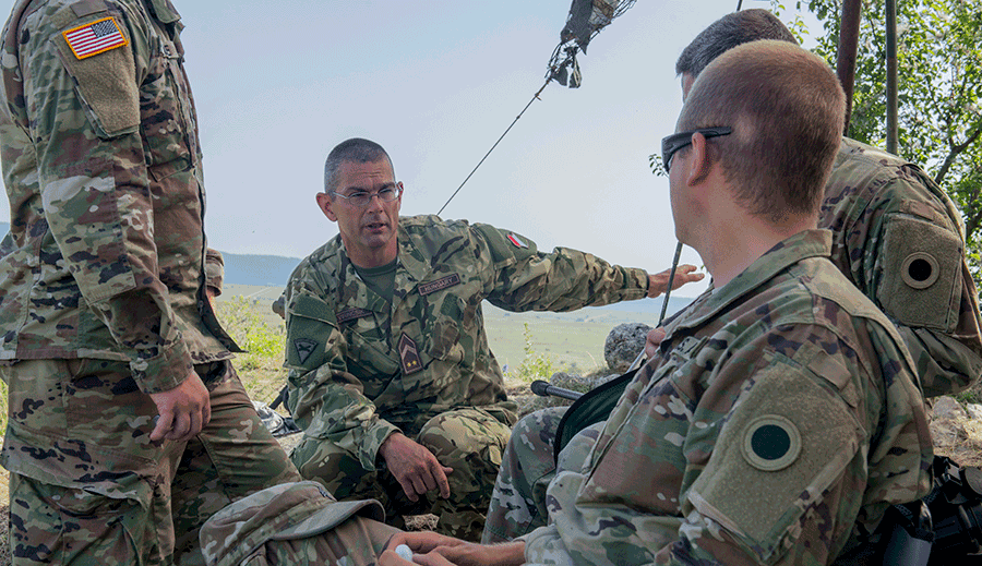 Hungarian Defence Forces Command Sgt. Maj. Arpad Virincsik briefs Ohio National Guard Soldiers. 