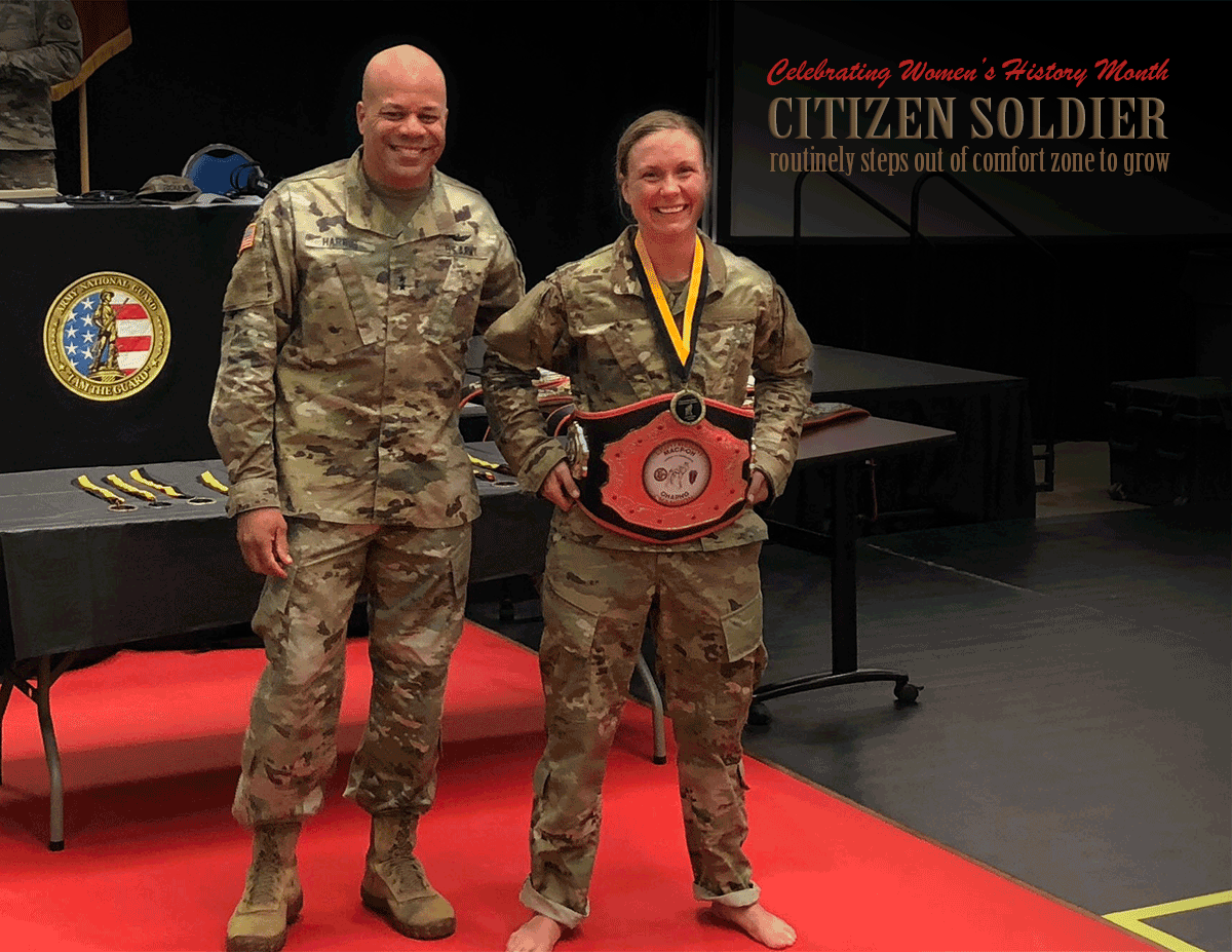 Stearns poses with Maj. Gen. Harris while displaying her belt