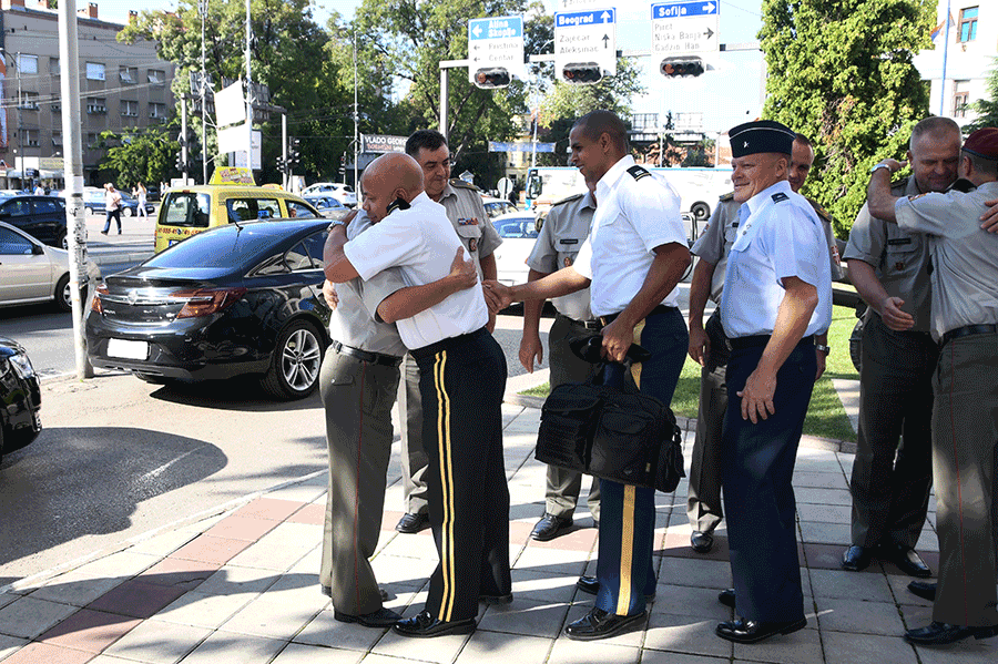U.S. Army Maj. Gen. John C. Harris Jr. and Serbian Armed Forces Lt. Gen. Milosav Simović share a hug while saying goodbye