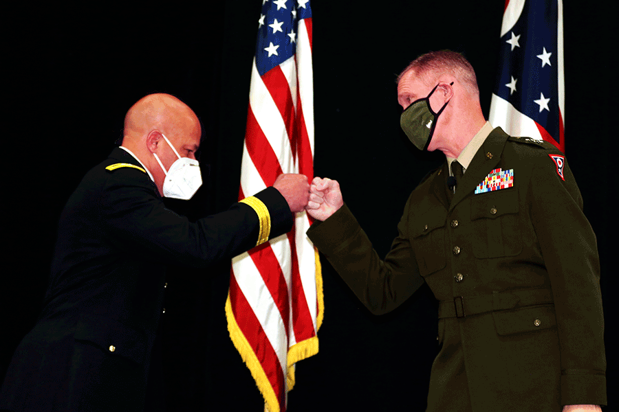 Maj. Gen. John C. Harris, Jr. and Maj. Gen. Steve Stivers bump fists.