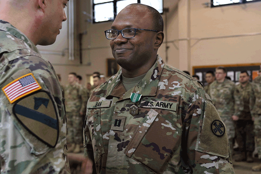 Capt. Sulaiman Bah is awarded an Army Commendation Medal.