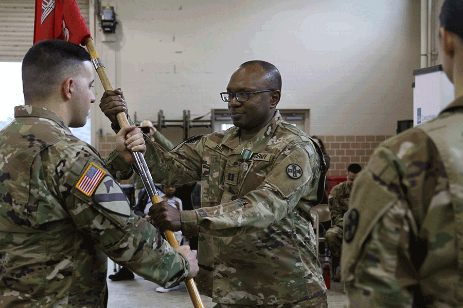 Capt. Sulaiman Bah receives the guidon.