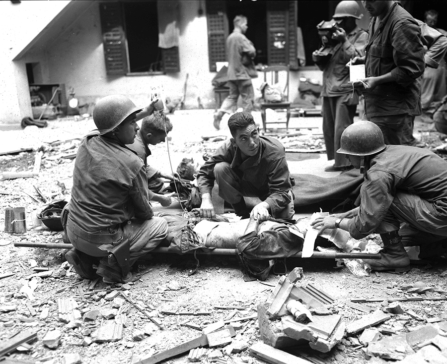 Medics give plasma to a Soldier. 