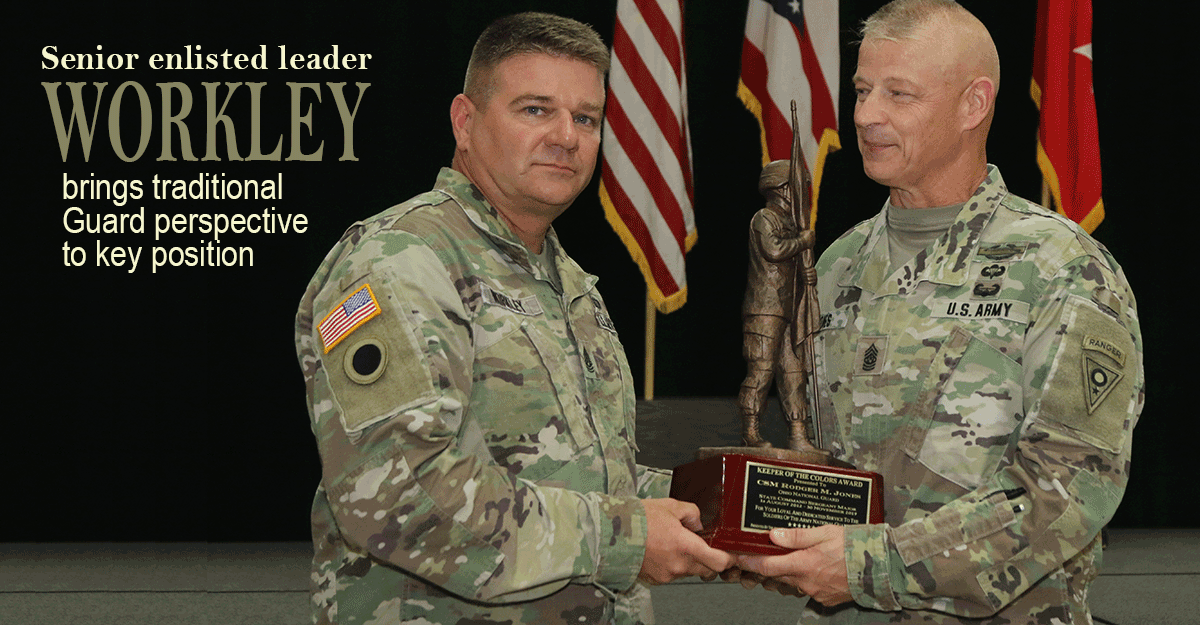 Command Sgt. Maj. William Workley presents the Keeper of the Colors Award to Command Sgt. Maj. Rodger M. Jones.