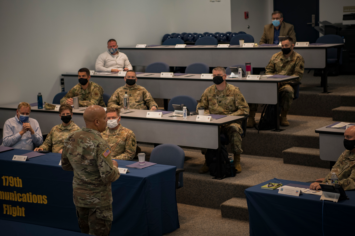 Maj. Gen. John C. Harris Jr. presenting in front of classroom of airmen.