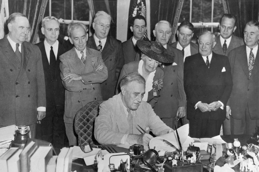 President Franklin D. Roosevelt signs the GI Bill of Rights at the White House, June 22, 1944.