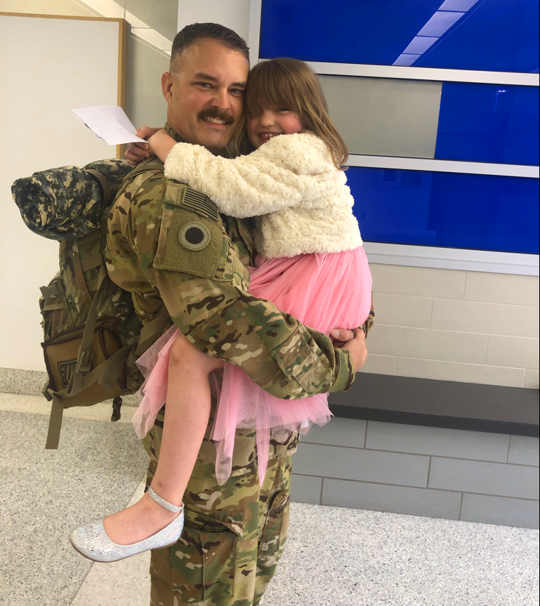 Lt. Col. John Whitney with daughter.
