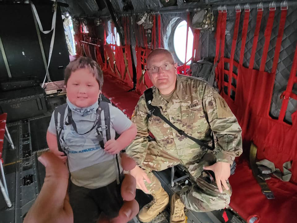 George Davis with cutout of son Park on aircraft during deployment.