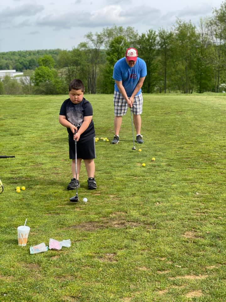 George Davis with son Park golfing.