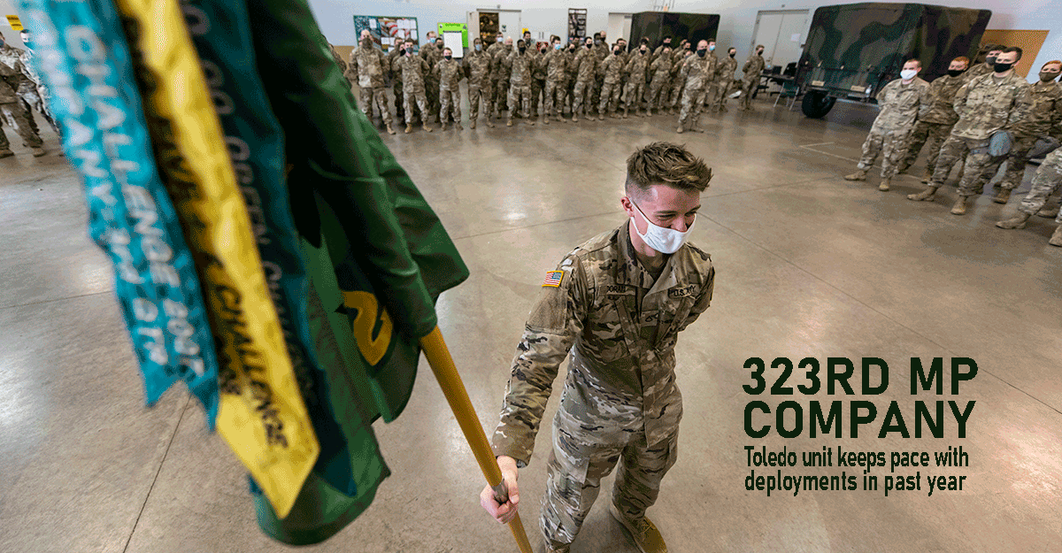 Pfc. Vincent Doran, a Soldier with the Ohio Army National Guard’s 323rd Military Police Company, holds the unit guidon during a formation at the Congresswoman Marcy Kaptur Readiness Center.