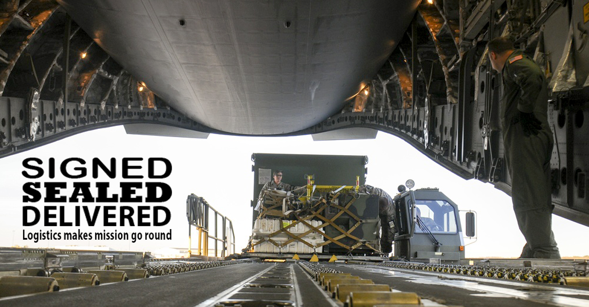 Airmen loading equipment and supplies into the back of a C-17 Globemaster III.