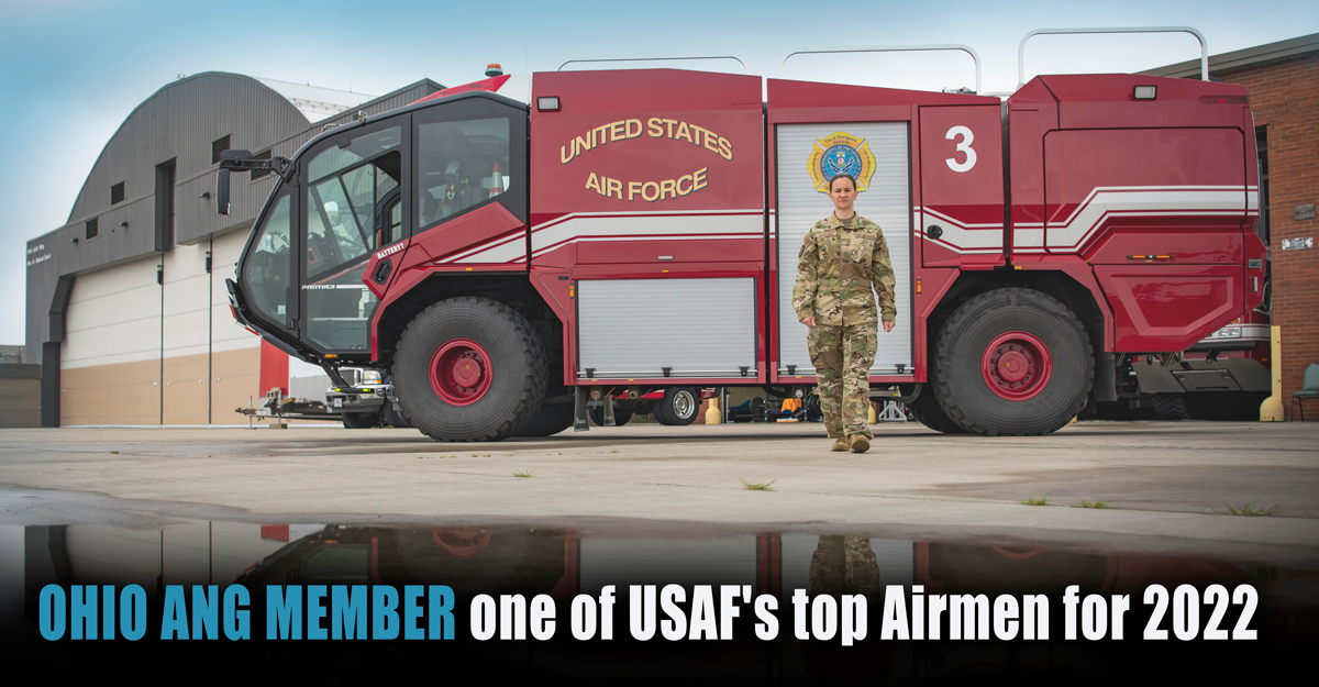 Senior Airman Kristina Schneider in front of fire engine at the 179th Airlift Wing.
