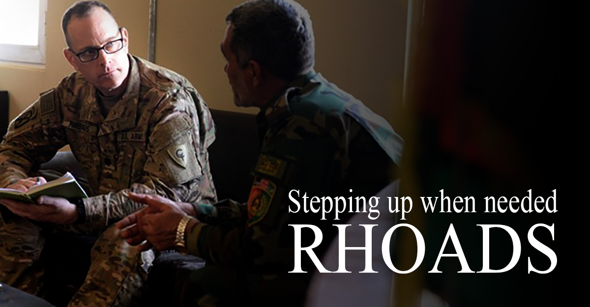 Col. David Rhoads sitting on sofa with Afghan National Army Col.